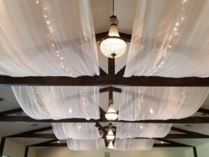 white-drape-string-lights-throughout-ceiling-close-up