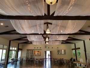 gorgeous-white-drape-and-string-lights-in-middle-of-ceiling