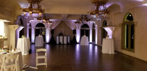 white-uplights-and-spanish-style-chandeliers