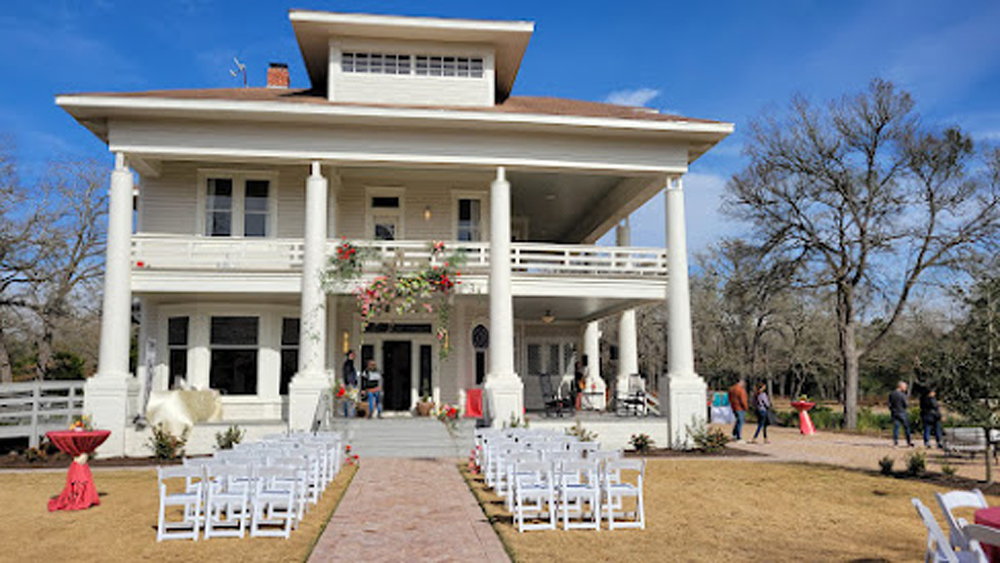 beautiful-older-home-with-lawn-chairs-outside-for-wedding