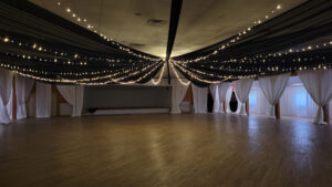 black-drape-with-string-lights-to-center-of-room
