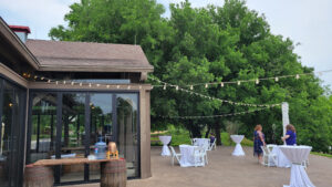 intimate-reception-daytime-with-string-lights-attached-to-tables-from-venue