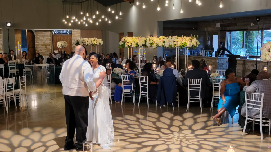 couple-dancing-beneath-patterned-gobo-and-string-lights