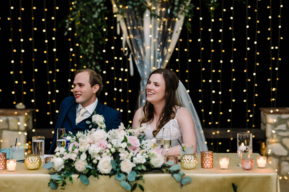 fairy-light-curtain-behind-bride-and-groom-at-vineyards-at-chappel-lodge