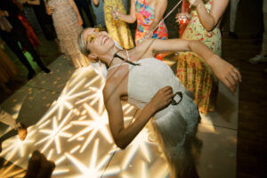 happy-bride-dancing-under-patterned-GOBO-Moravian-Stars-Disco-Balls-Pinspots-Contigo-Ranch